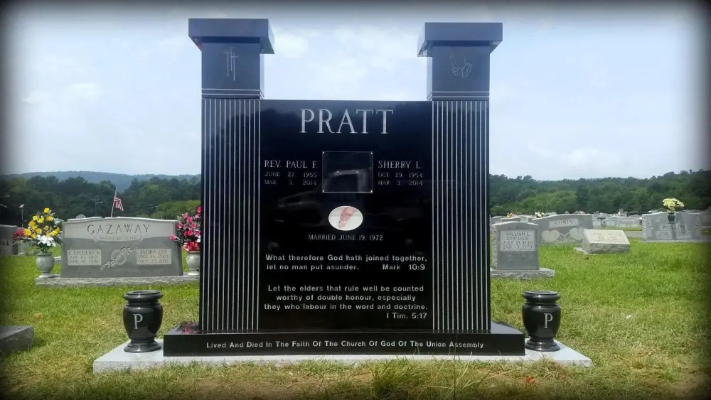 Black granite monument between two columns, Pratt